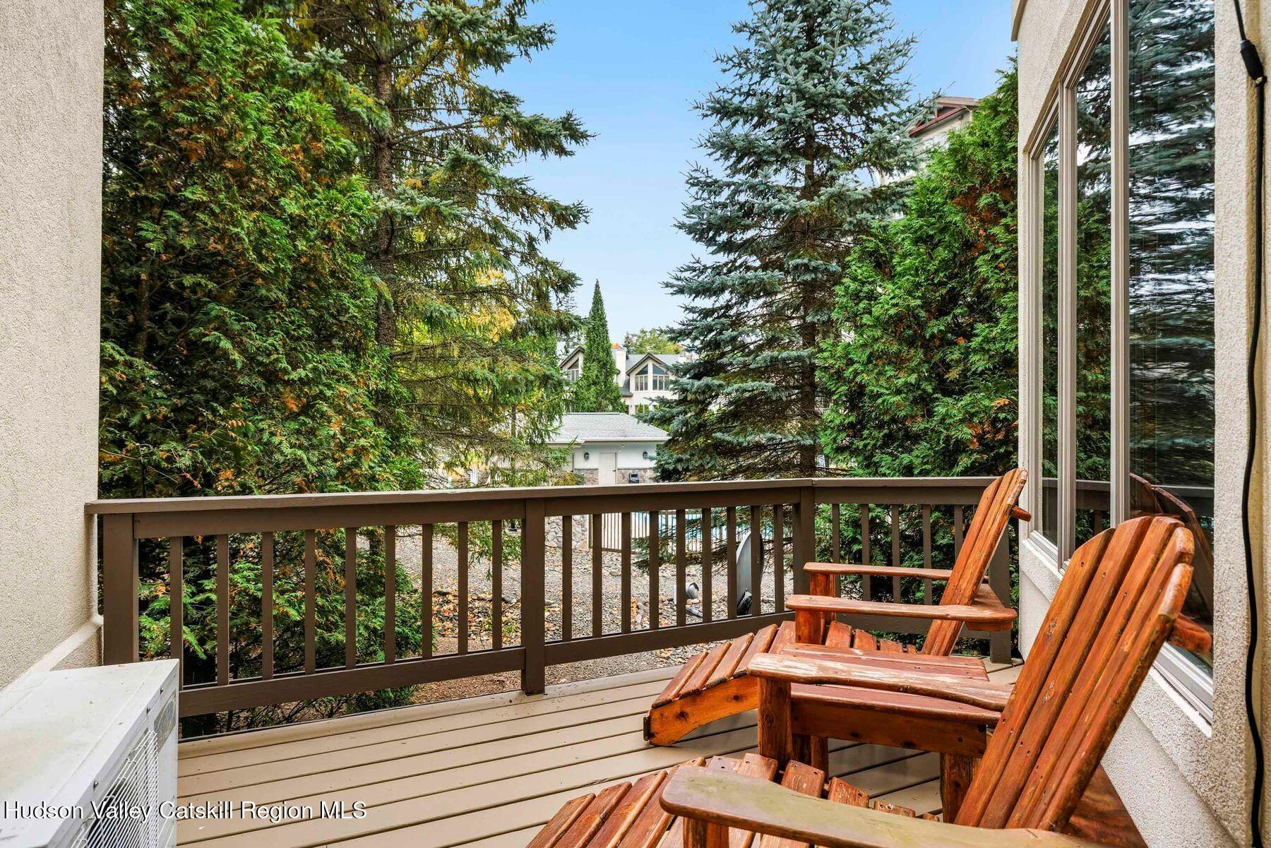 3 The Enclave Windham, NY 12496 - Photo 6 of 59 a view of balcony with wooden floor and outdoor seating