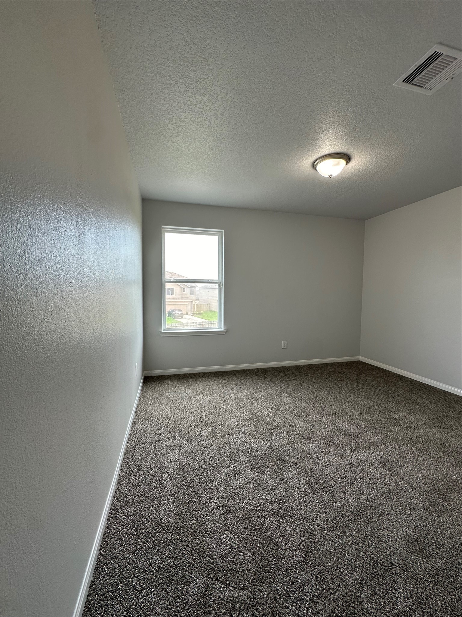 5819 Golden Cove Road Cove, TX 77523 - Photo 12 of 19 an empty room with a chair and a window