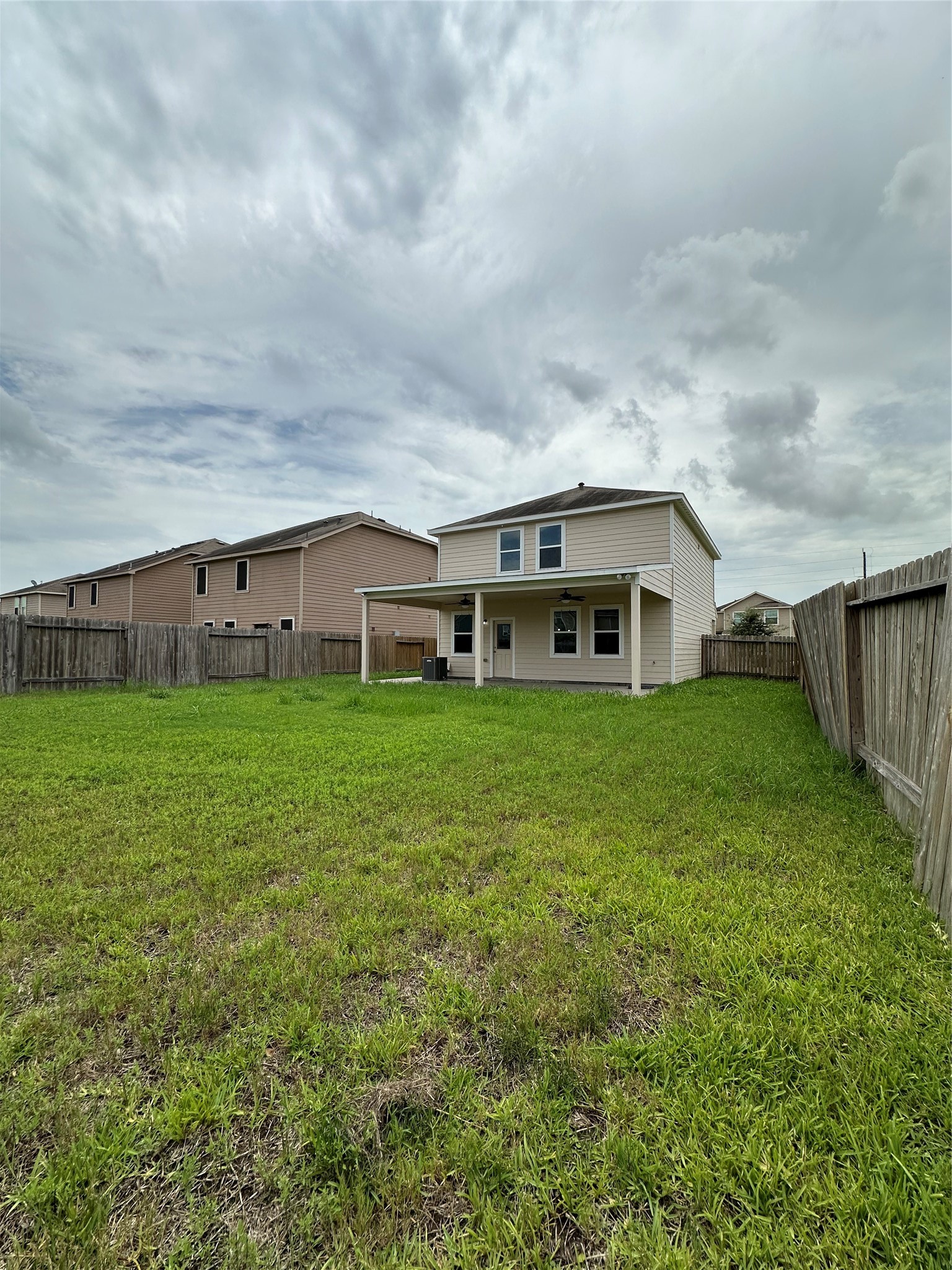 5819 Golden Cove Road Cove, TX 77523 - Photo 14 of 19 a view of house with backyard