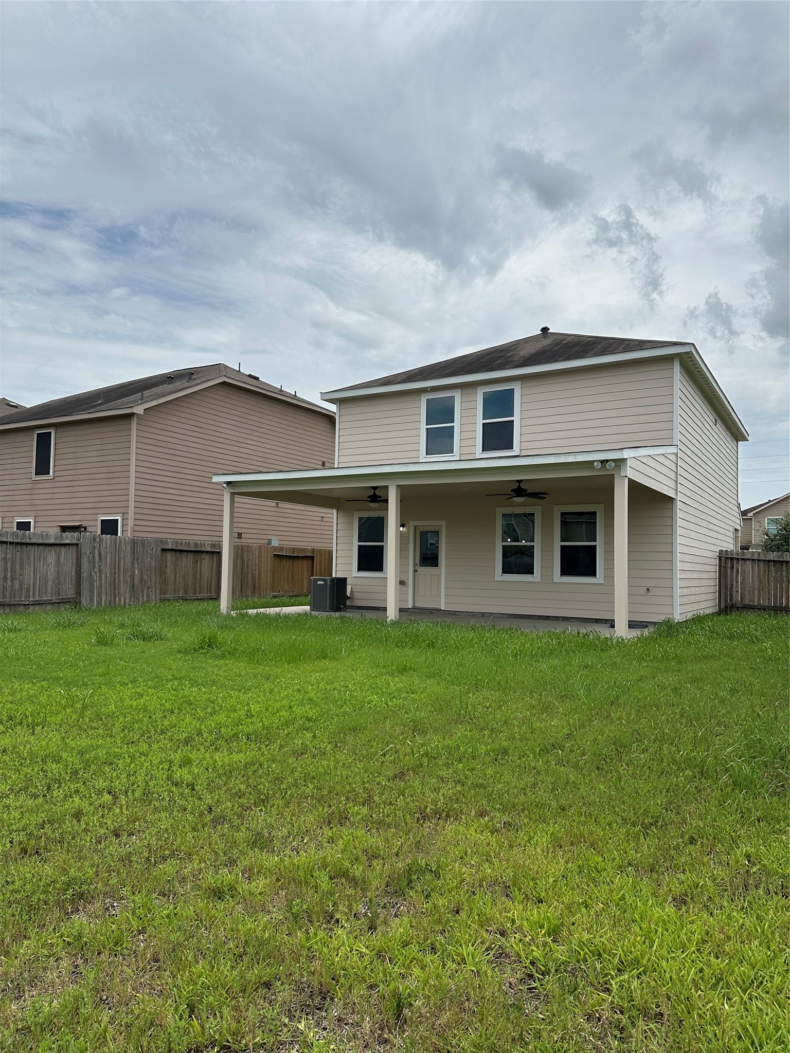 5819 Golden Cove Road Cove, TX 77523 - Photo 15 of 19 a front view of a house with a garden