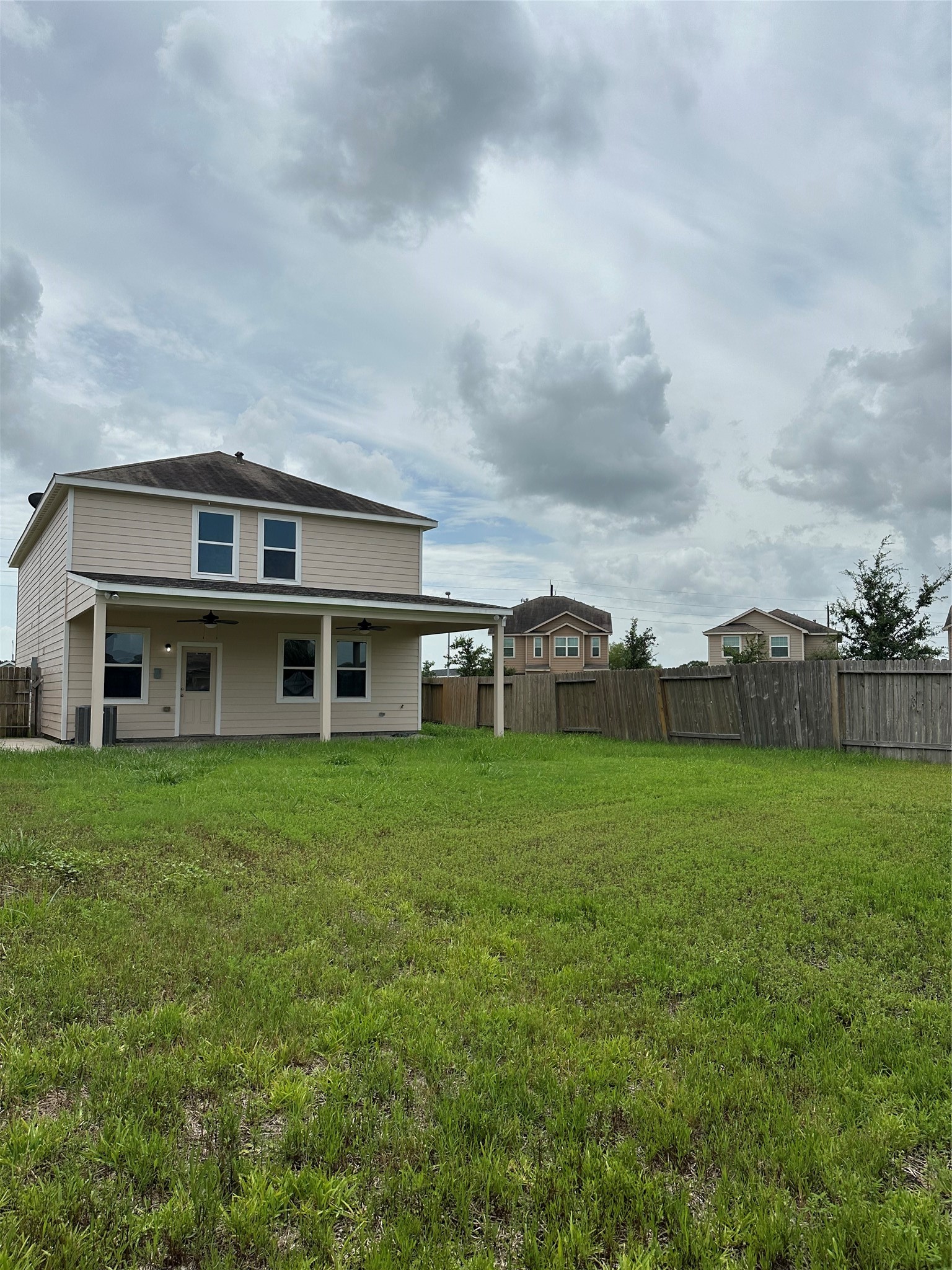 5819 Golden Cove Road Cove, TX 77523 - Photo 16 of 19 a view of a house with a big yard and large trees