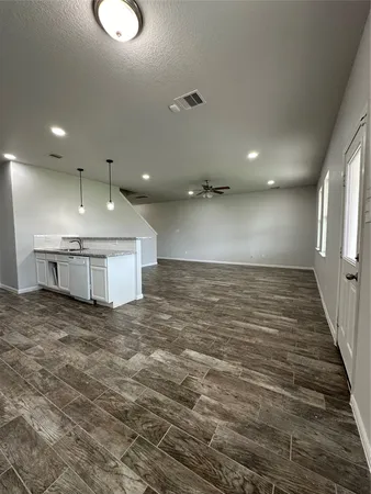 a view of a hallway with an empty room