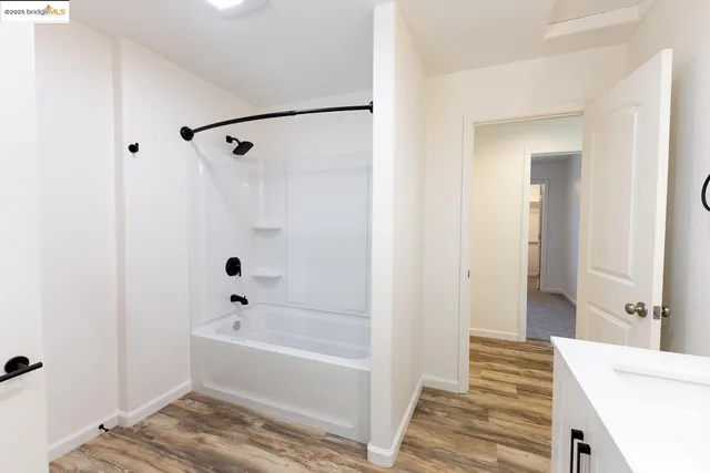 a bathroom with a bathtub and shower