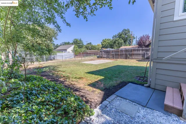 a view of a backyard with sitting area