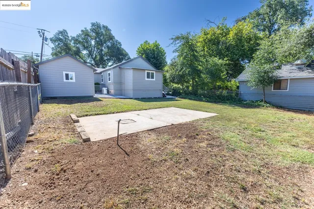 a house view with a backyard space