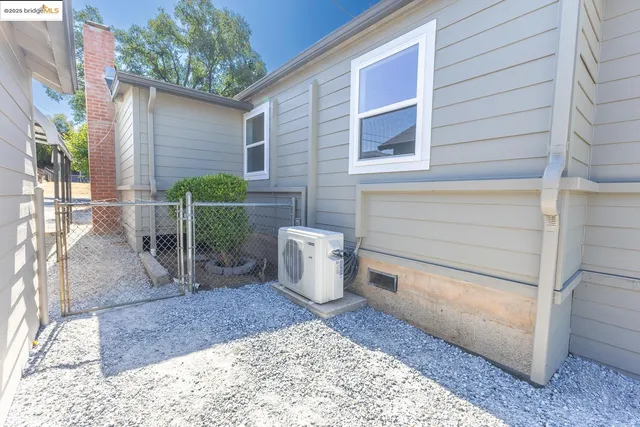 a view of a backyard with sitting area