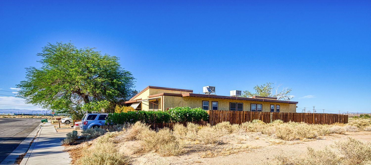 112 South Valley Street Ridgecrest, CA 93555 - Photo 6 of 19 a front view of a house with a yard