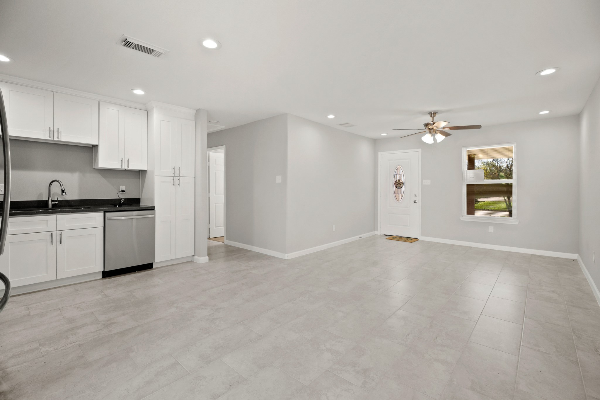 5123 Ridgeway Drive Houston, TX 77033 - Photo 3 of 21 This space is perfect for entertaining with a fantastic open layout between the living, kitchen, and dining areas.