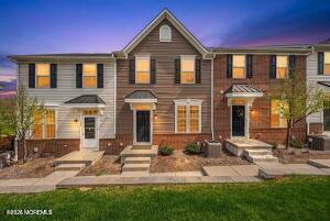 1306 English Lane, Unit 1306 Parlin, NJ 08859 - Photo 1 of 41 a front view of a house with a yard