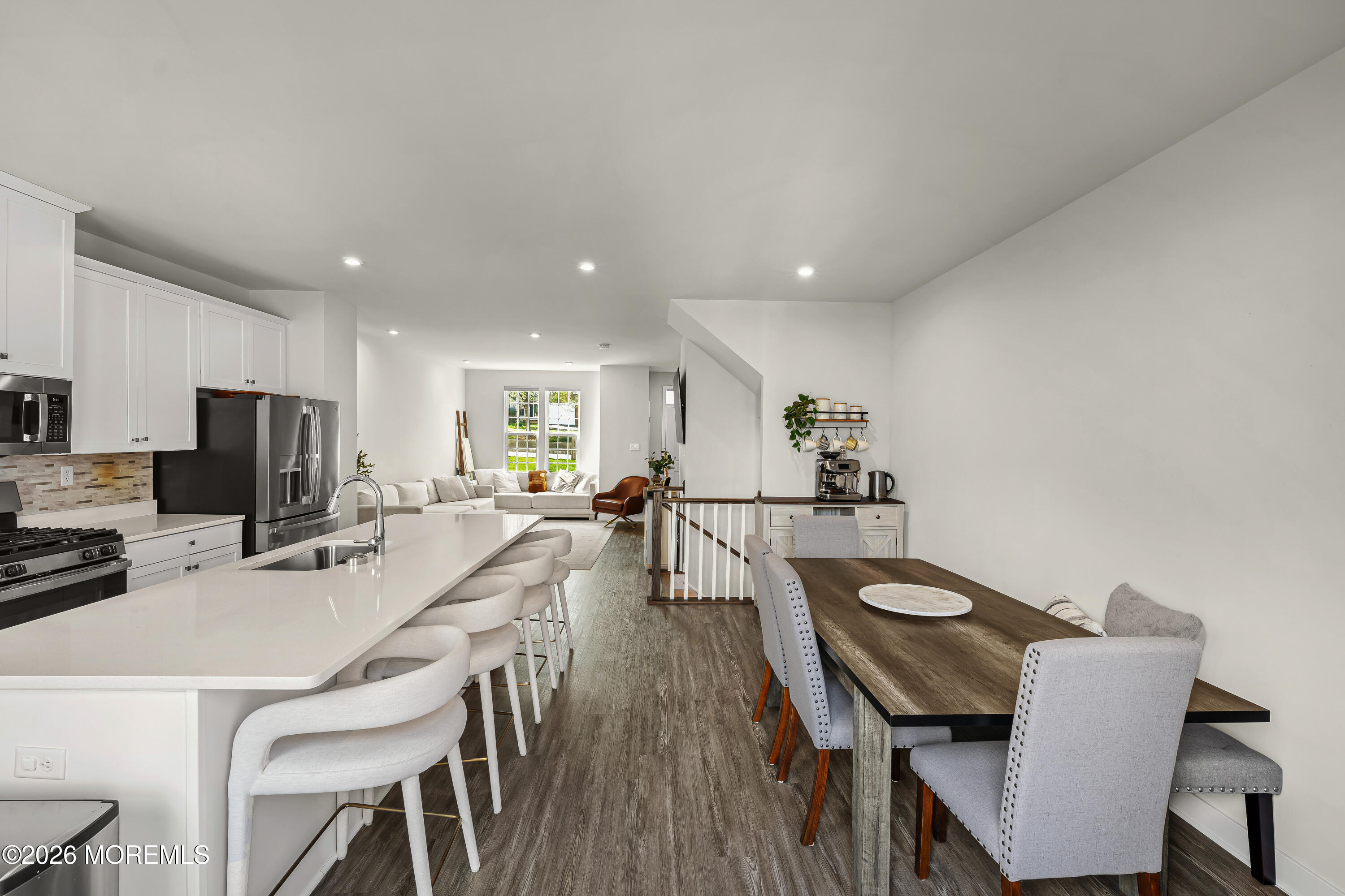 1306 English Lane, Unit 1306 Parlin, NJ 08859 - Photo 15 of 41 a dining room with furniture and wooden floor