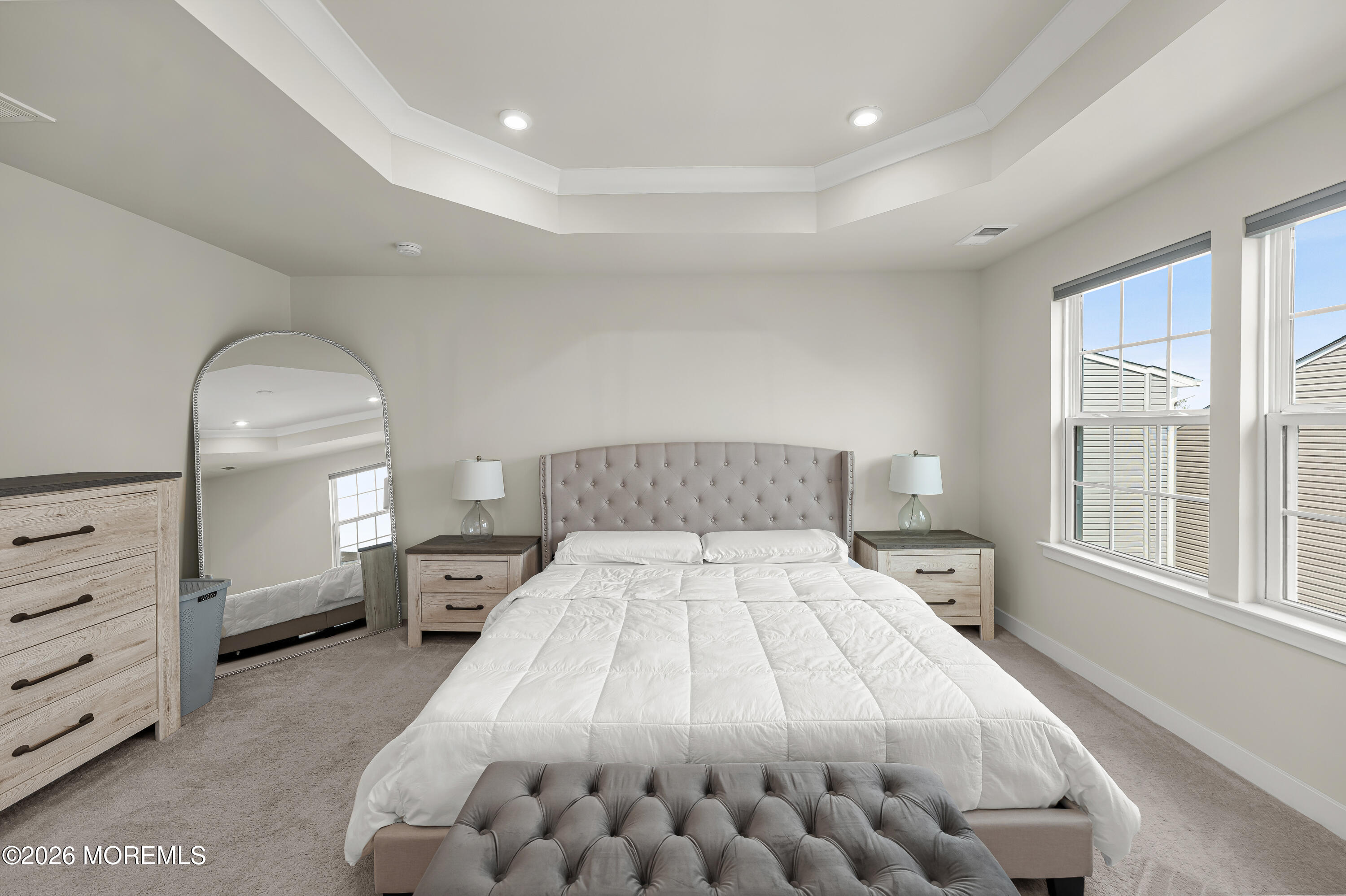 1306 English Lane, Unit 1306 Parlin, NJ 08859 - Photo 16 of 41 a bedroom with a large bed and a dresser