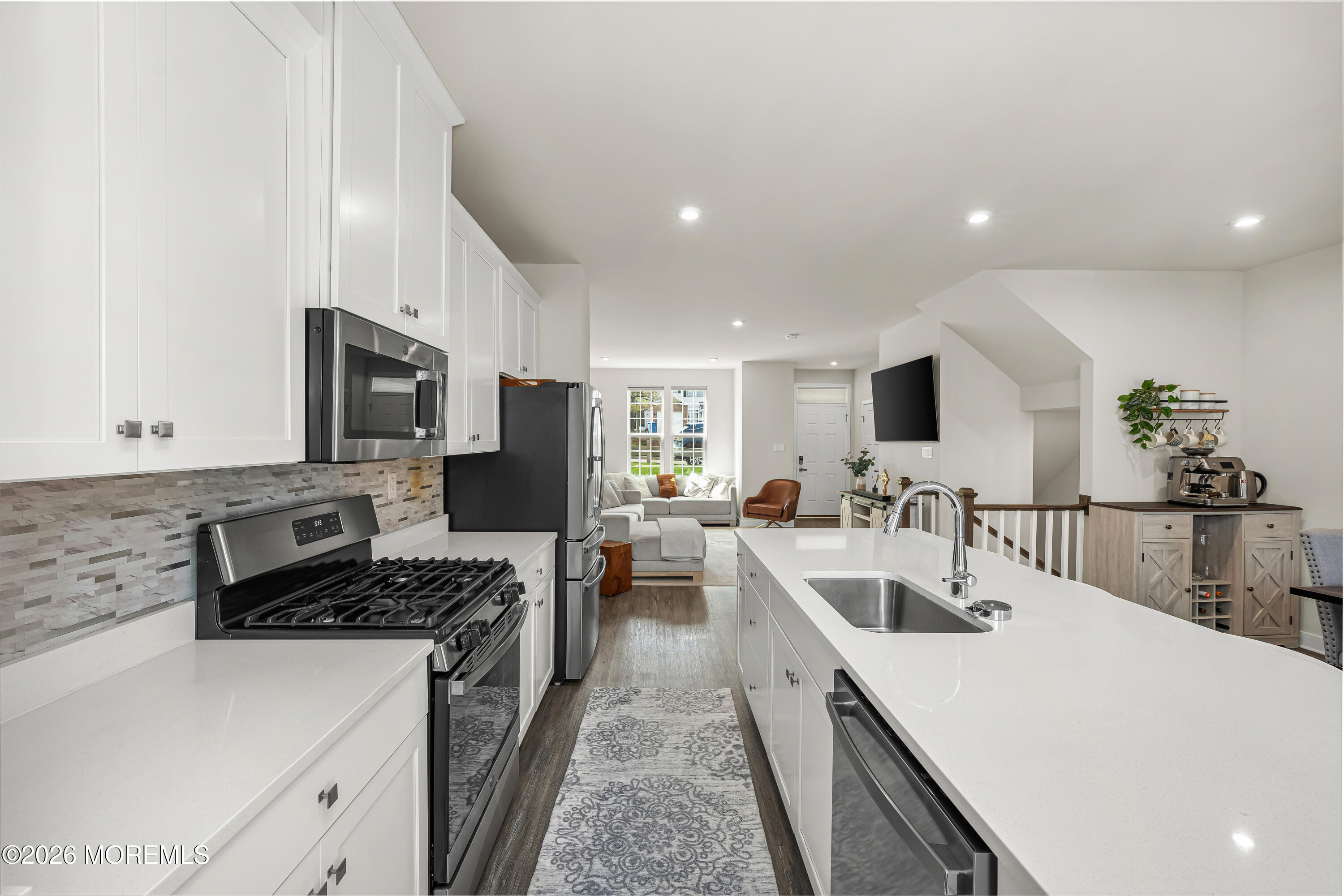 1306 English Lane, Unit 1306 Parlin, NJ 08859 - Photo 18 of 41 a large kitchen with a large counter top appliances and cabinets