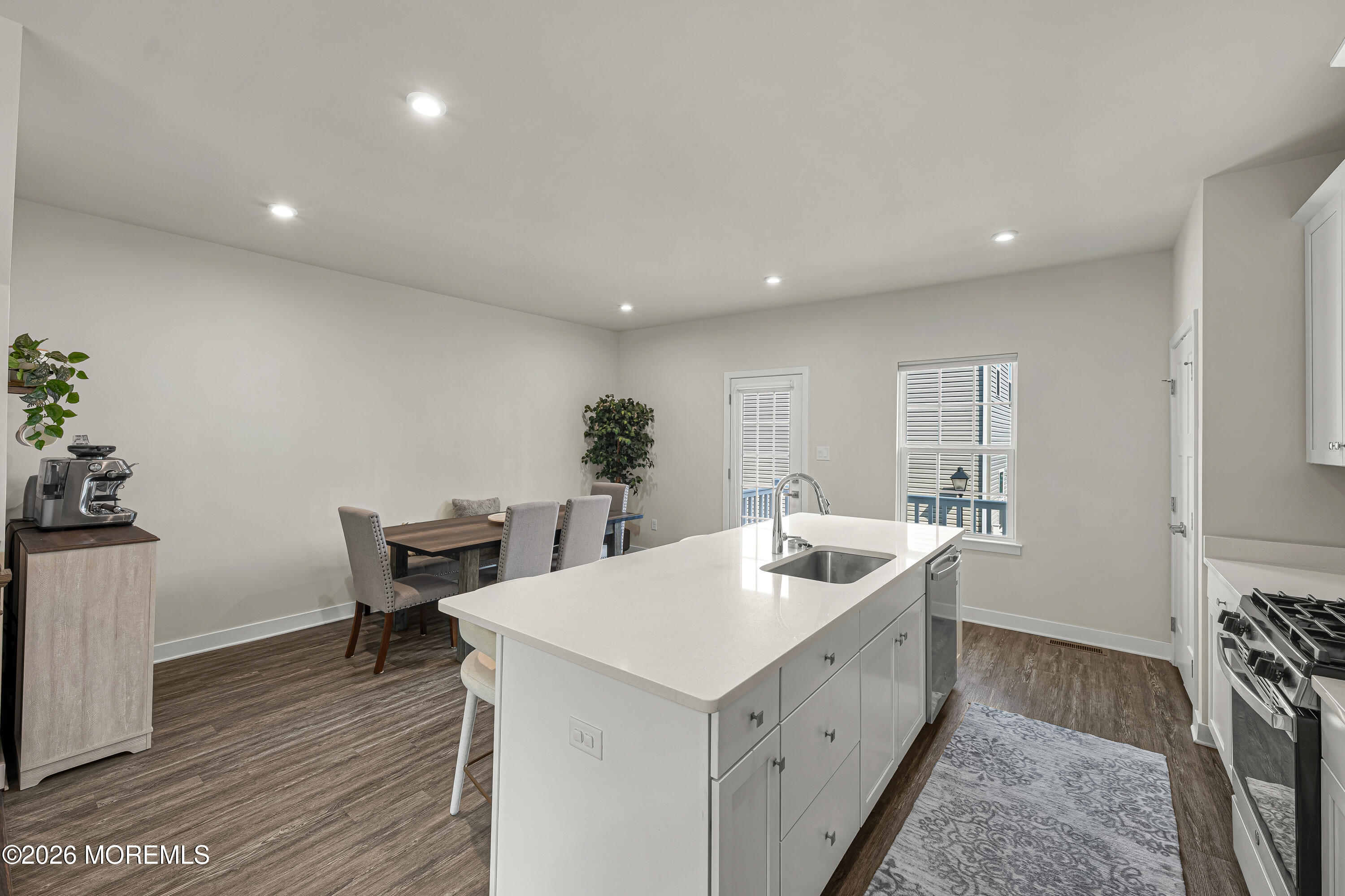 1306 English Lane, Unit 1306 Parlin, NJ 08859 - Photo 19 of 41 a kitchen with sink and center island