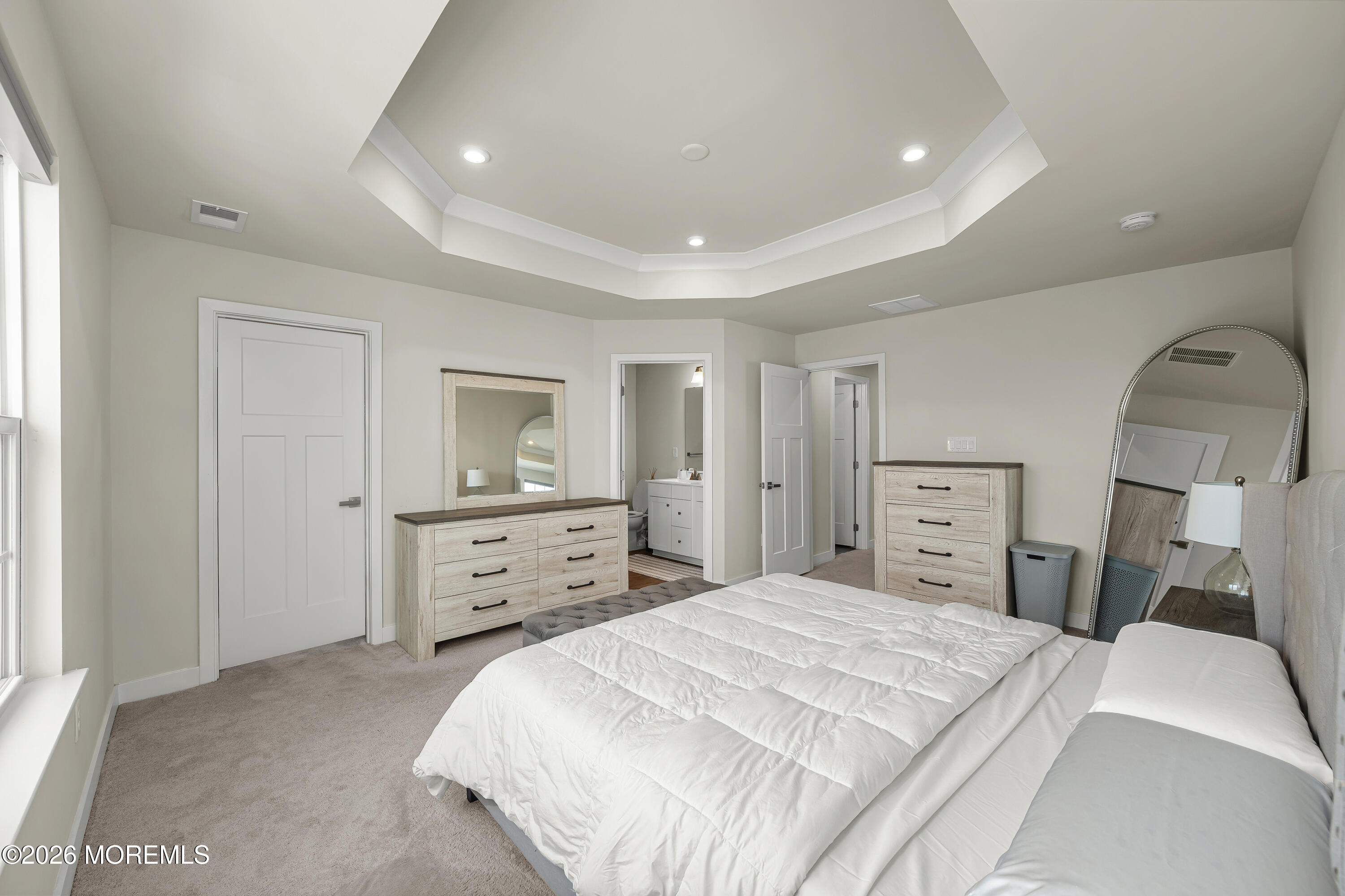 1306 English Lane, Unit 1306 Parlin, NJ 08859 - Photo 26 of 41 a bedroom with a bed and a dresser