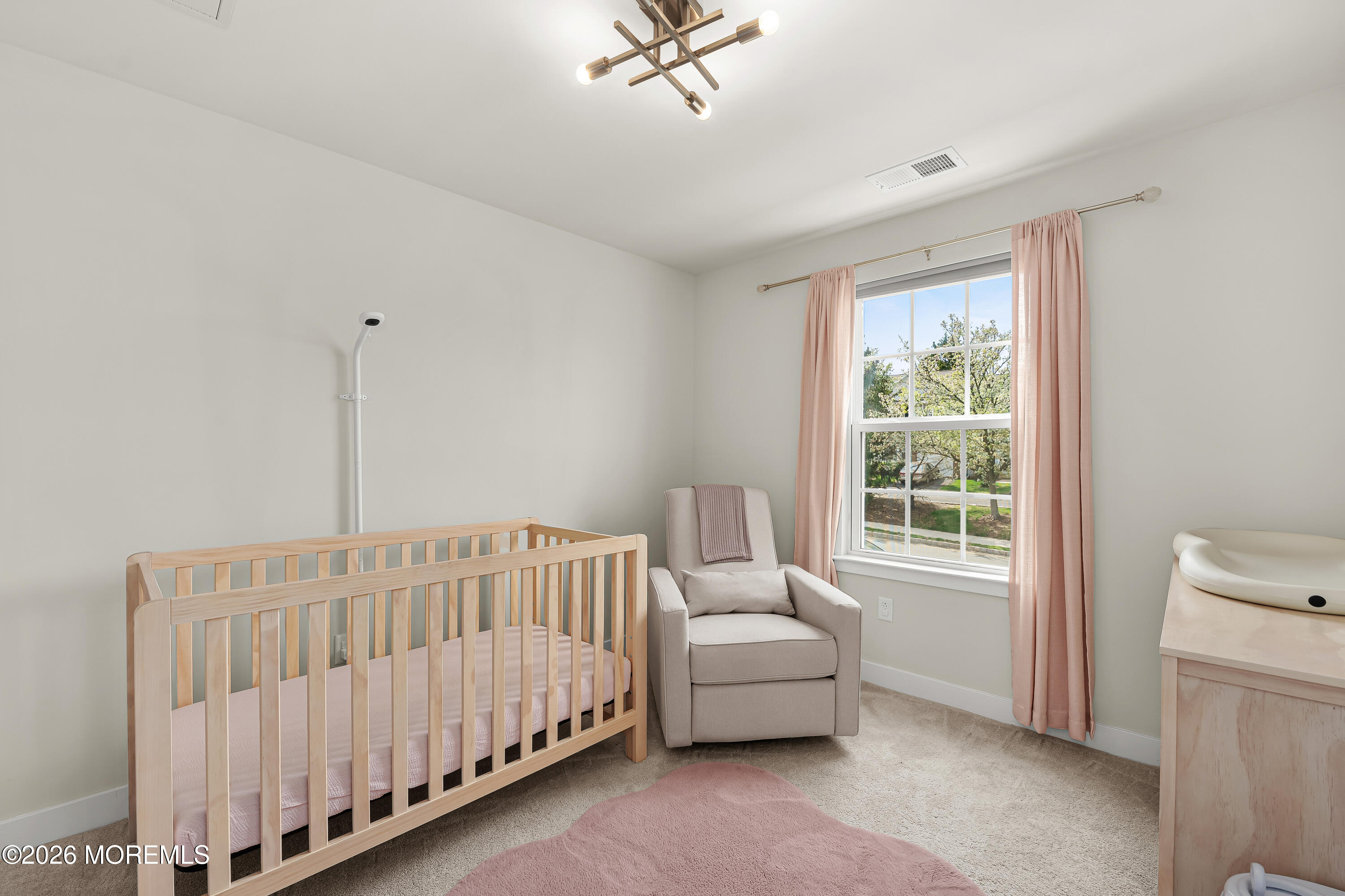1306 English Lane, Unit 1306 Parlin, NJ 08859 - Photo 28 of 41 a bedroom with a bed and a window