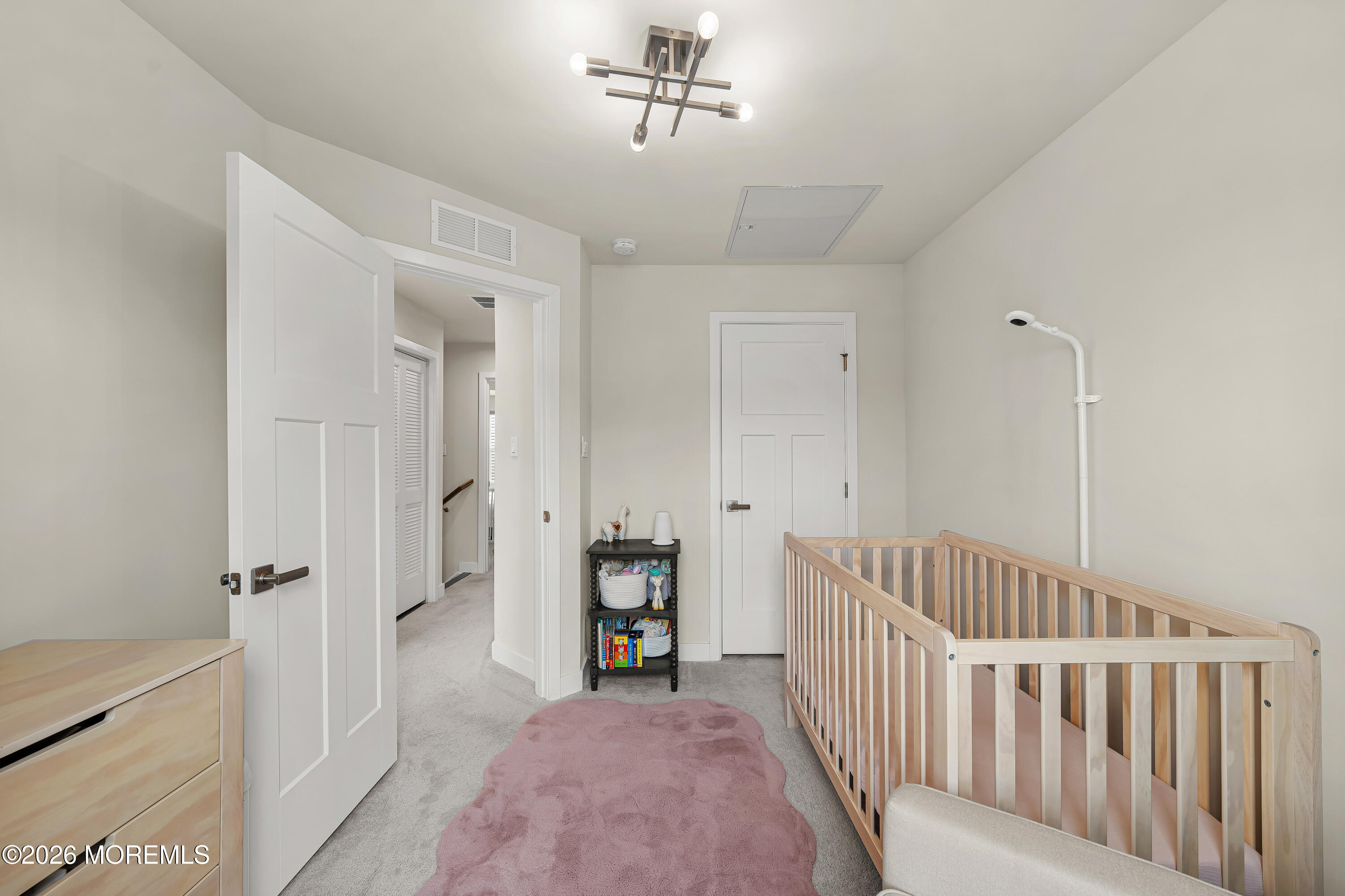 1306 English Lane, Unit 1306 Parlin, NJ 08859 - Photo 29 of 41 a view of a bedroom with wooden floor & a ceiling fan