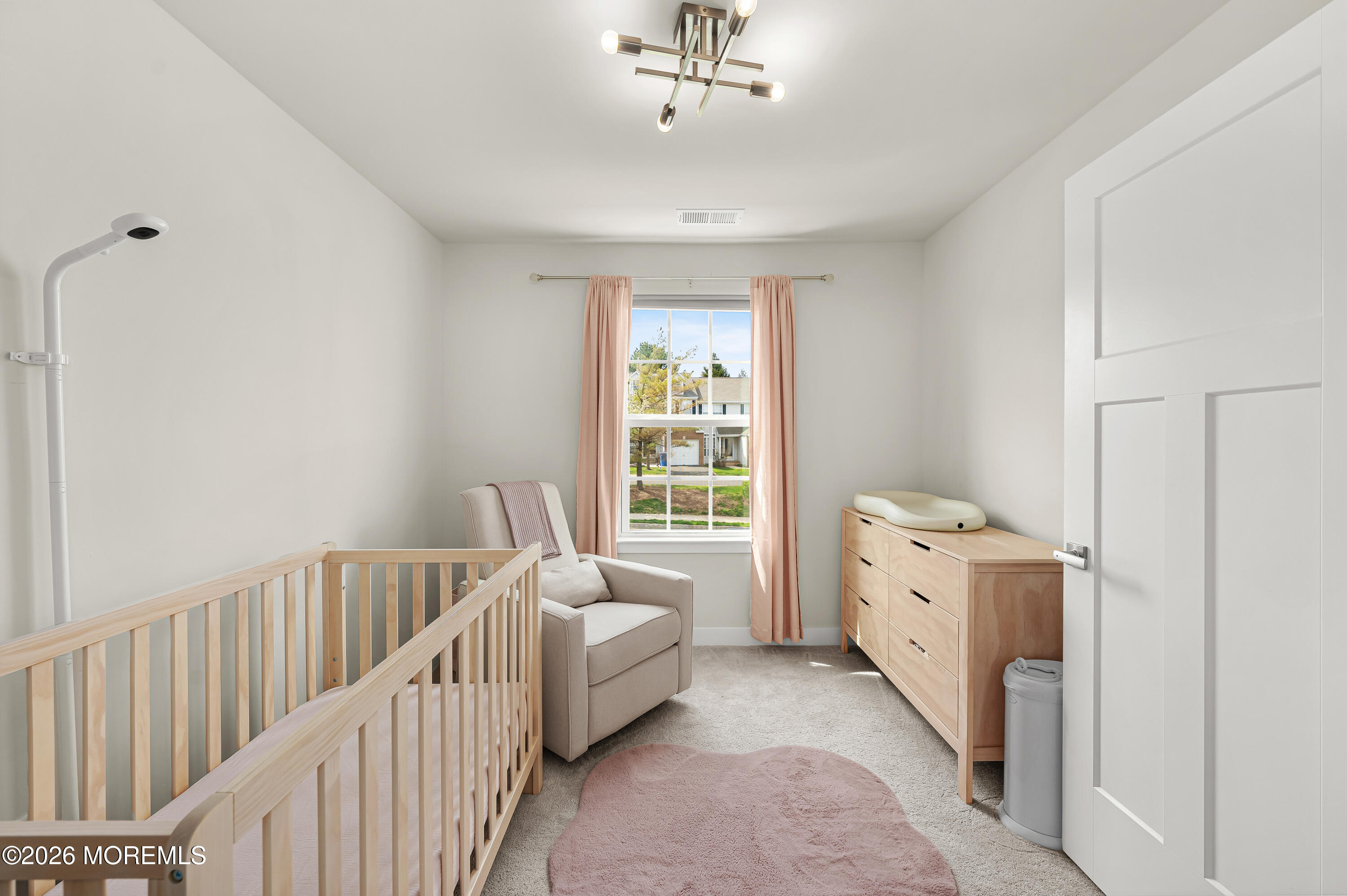 1306 English Lane, Unit 1306 Parlin, NJ 08859 - Photo 31 of 41 a room with a bed and a window