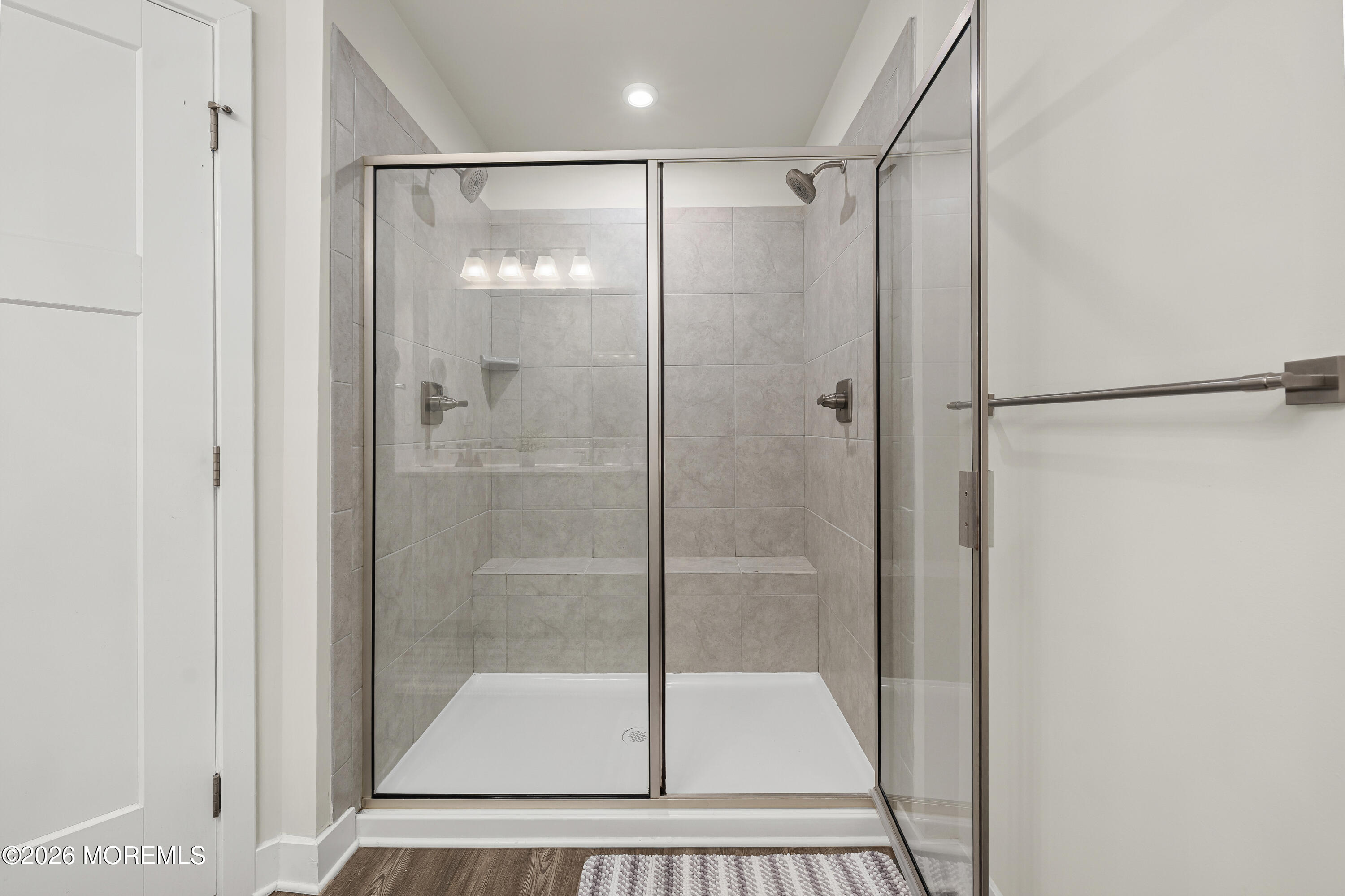 1306 English Lane, Unit 1306 Parlin, NJ 08859 - Photo 35 of 41 a bathroom with a glass shower door