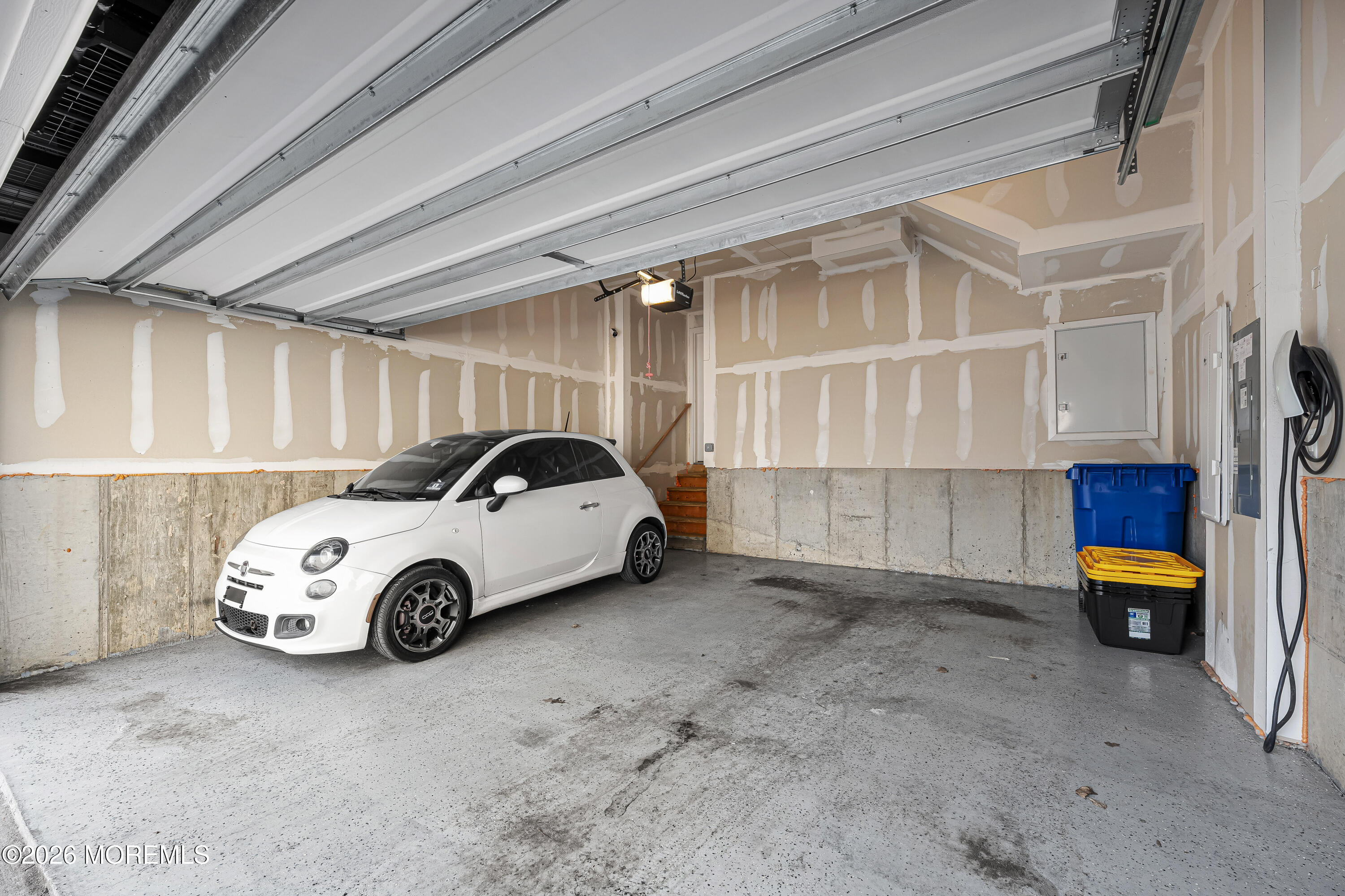 1306 English Lane, Unit 1306 Parlin, NJ 08859 - Photo 37 of 41 a car parked in a garage