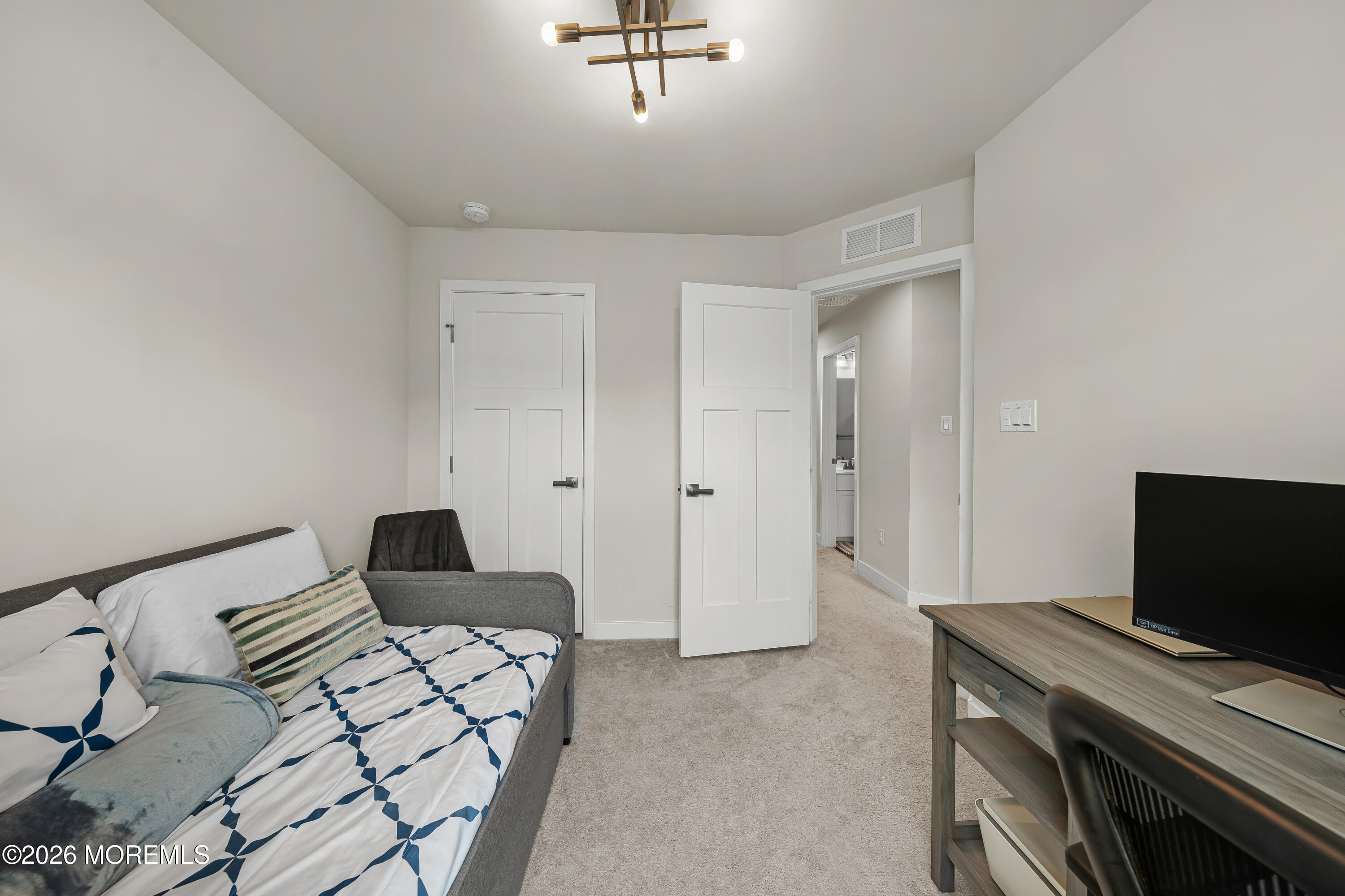 1306 English Lane, Unit 1306 Parlin, NJ 08859 - Photo 4 of 41 a bedroom with a bed and a television