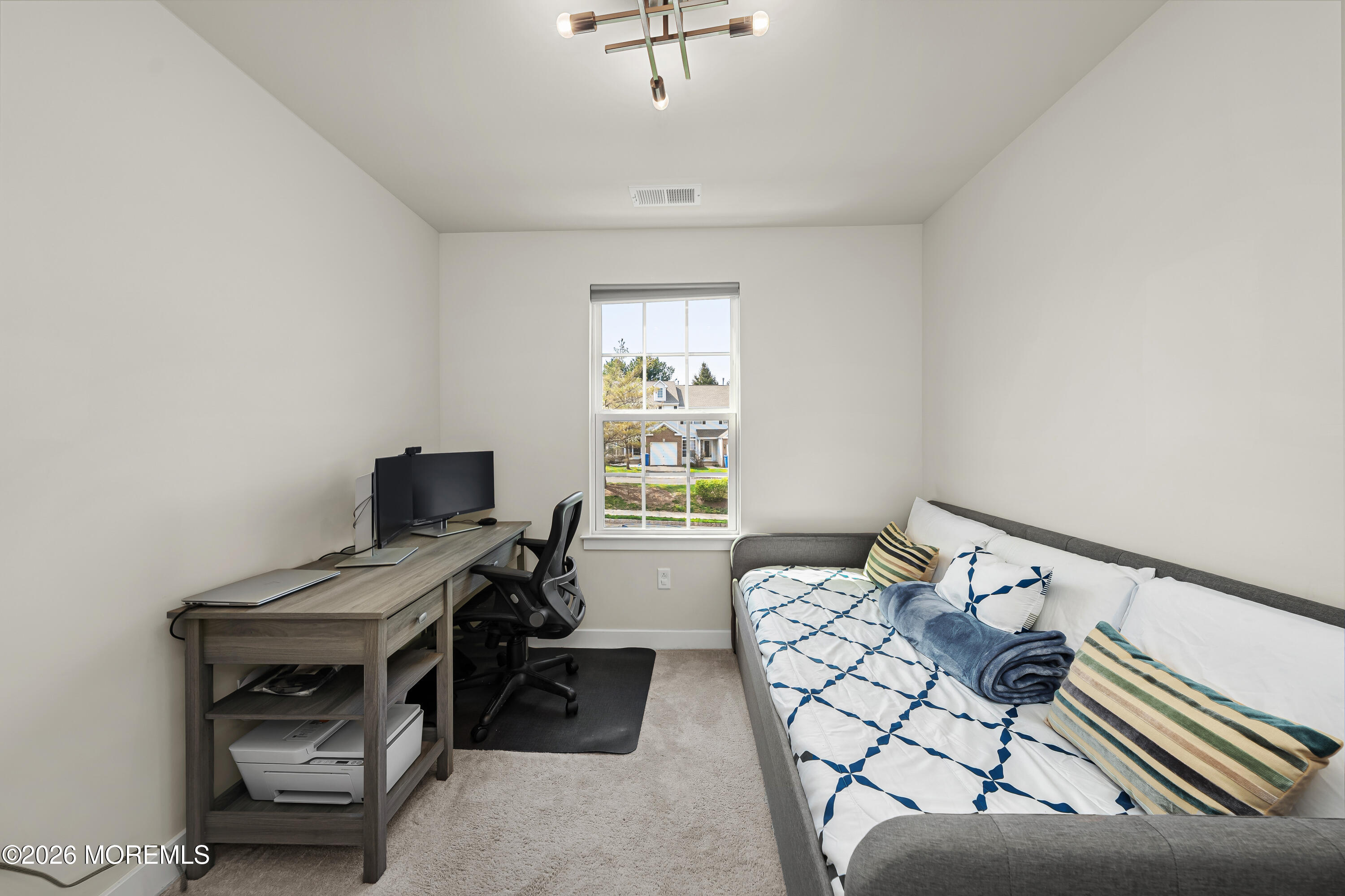 1306 English Lane, Unit 1306 Parlin, NJ 08859 - Photo 5 of 41 a bedroom with furniture and a window