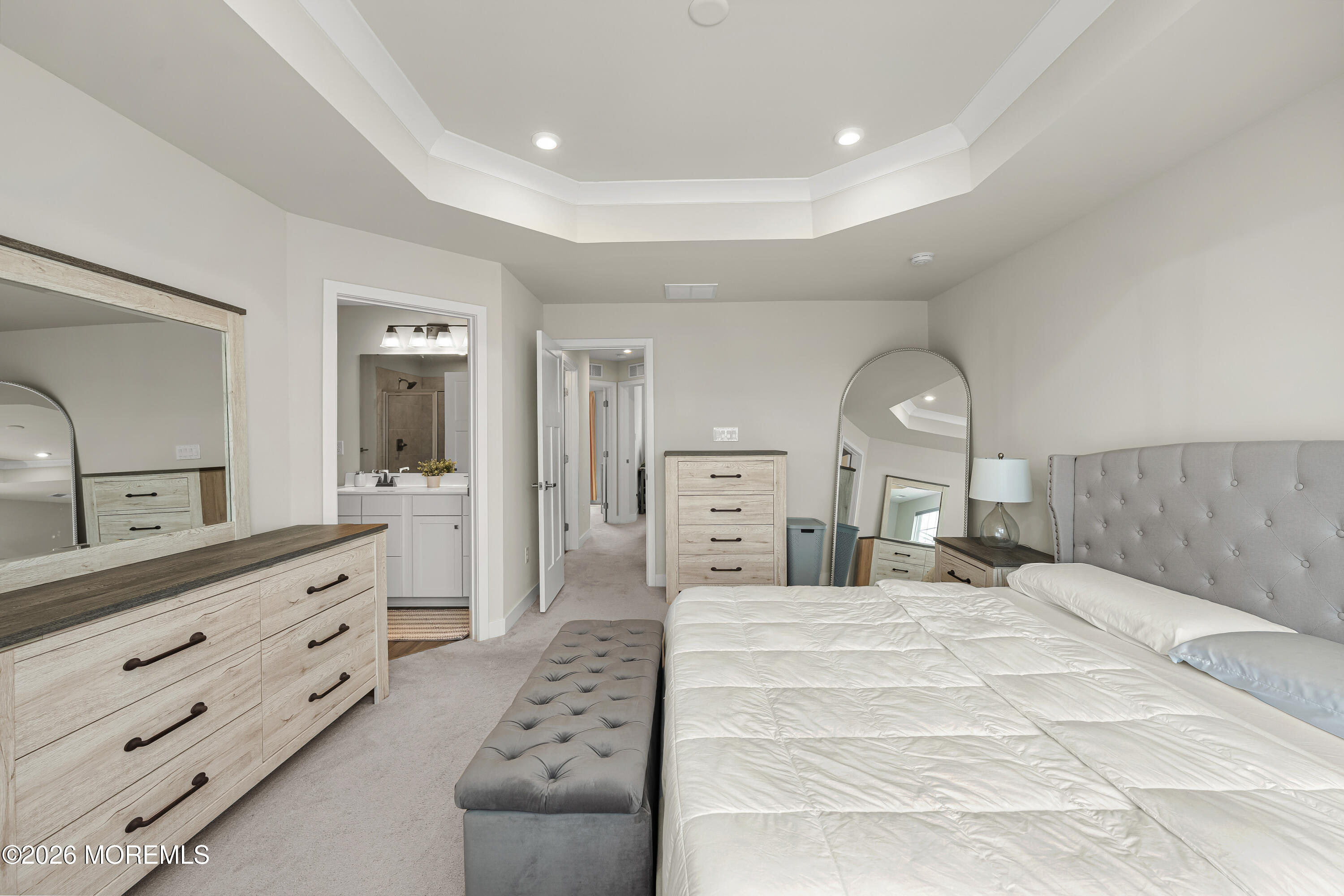 1306 English Lane, Unit 1306 Parlin, NJ 08859 - Photo 8 of 41 a large bedroom with a large bed and a dresser