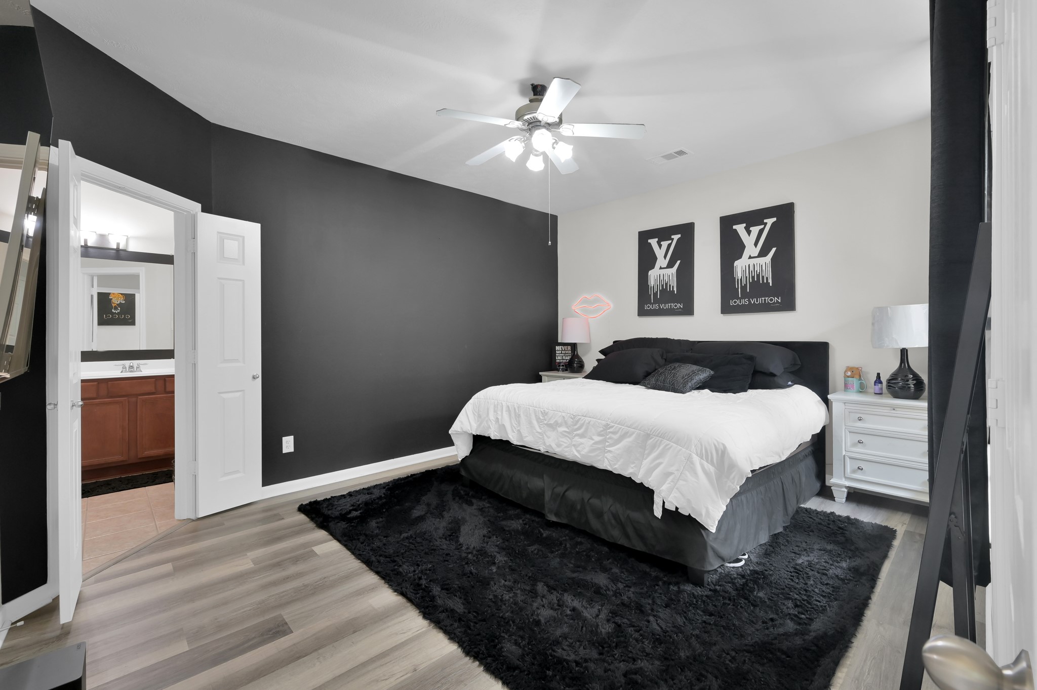 3607 Cedar Flats Lane Spring, TX 77386 - Photo 14 of 47 a bedroom with a large bed and a chandelier