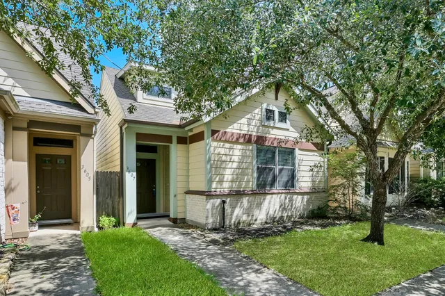 front view of a house with a yard