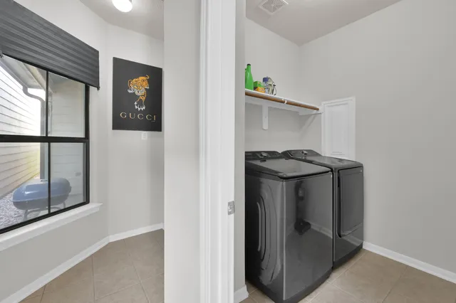 a view of hallway with washer and dryer