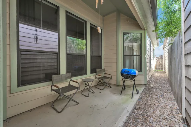 a outdoor space with a couch and a potted plant
