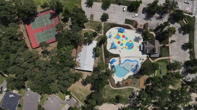 an aerial view of a house with a swimming pool