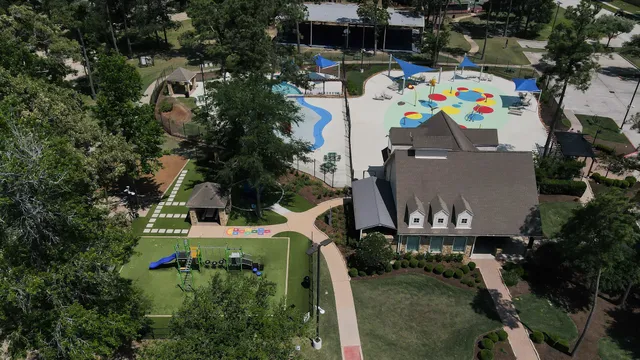 an aerial view of multiple houses with outdoor space