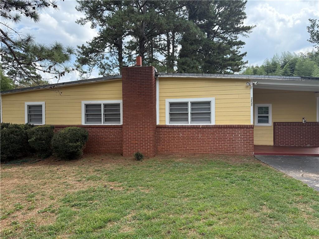 a view of backyard with a garden and plants
