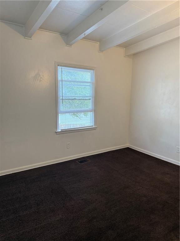2828 Waters Road Southwest Atlanta, GA 30354 - Photo 3 of 10 an empty room with wooden floor and windows
