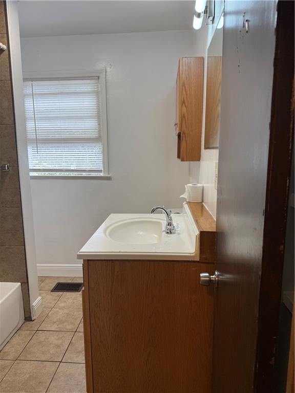 2828 Waters Road Southwest Atlanta, GA 30354 - Photo 4 of 10 a bathroom with a sink and a mirror