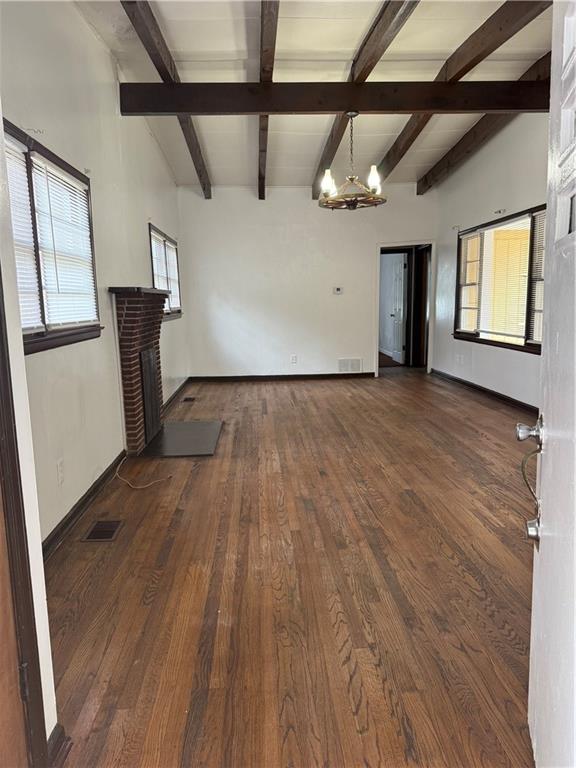 2828 Waters Road Southwest Atlanta, GA 30354 - Photo 8 of 10 a view of an empty room with a window and wooden floor