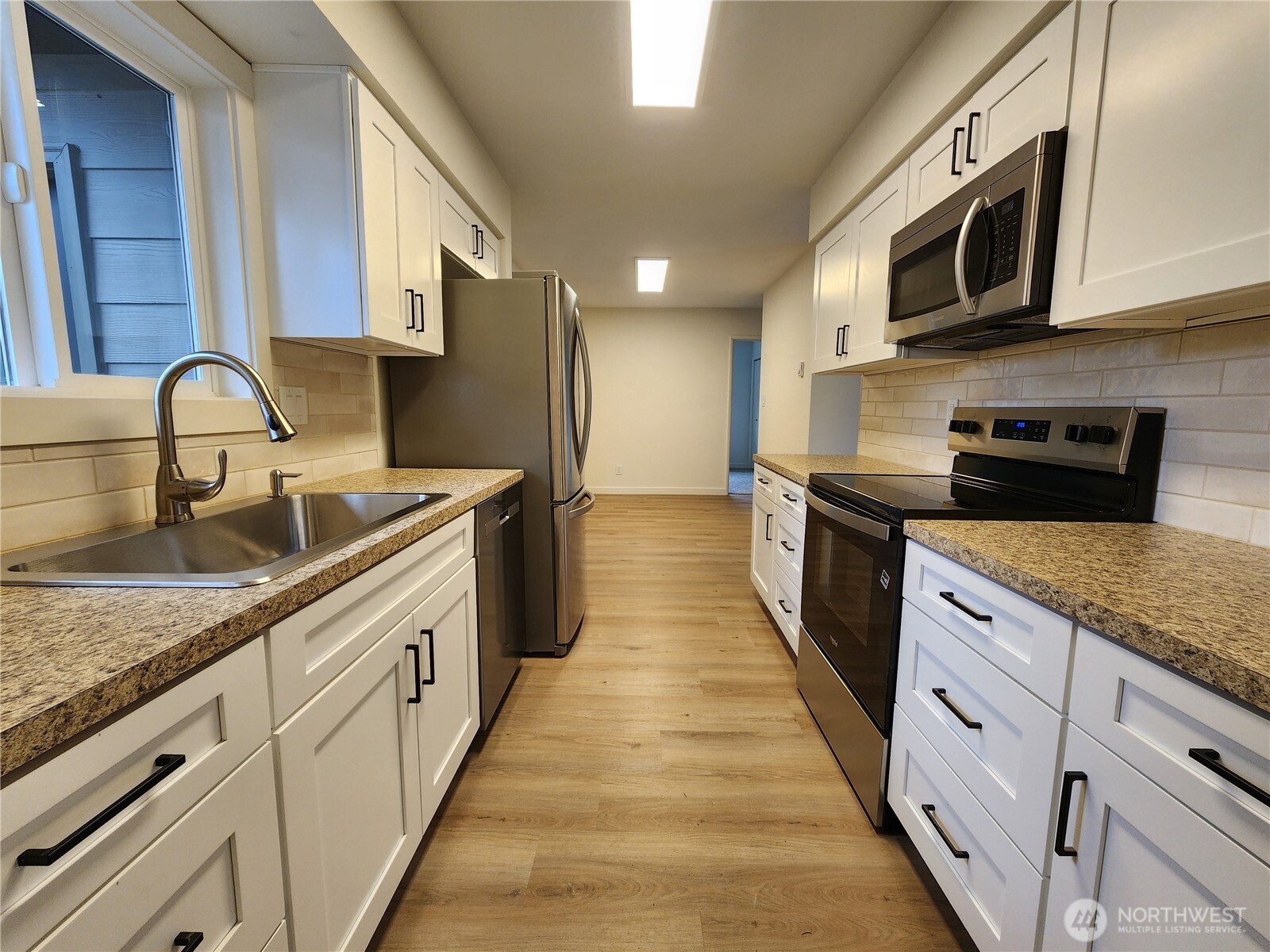 103 Kraft Road Longview, WA 98632 - Photo 7 of 19 a large kitchen with stainless steel appliances granite countertop a lot of counter space