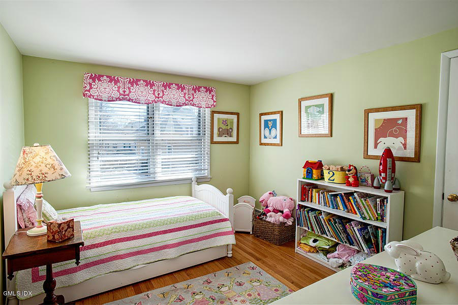 42 Field Road Cos Cob, CT 06807 - Photo 11 of 14 a bedroom with furniture and a book shelf