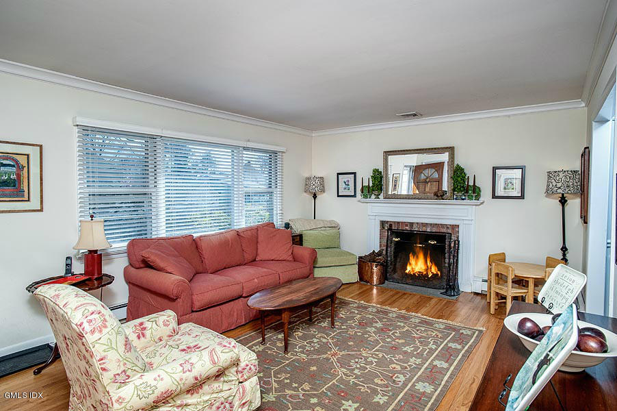 42 Field Road Cos Cob, CT 06807 - Photo 4 of 14 a living room with furniture and a fireplace