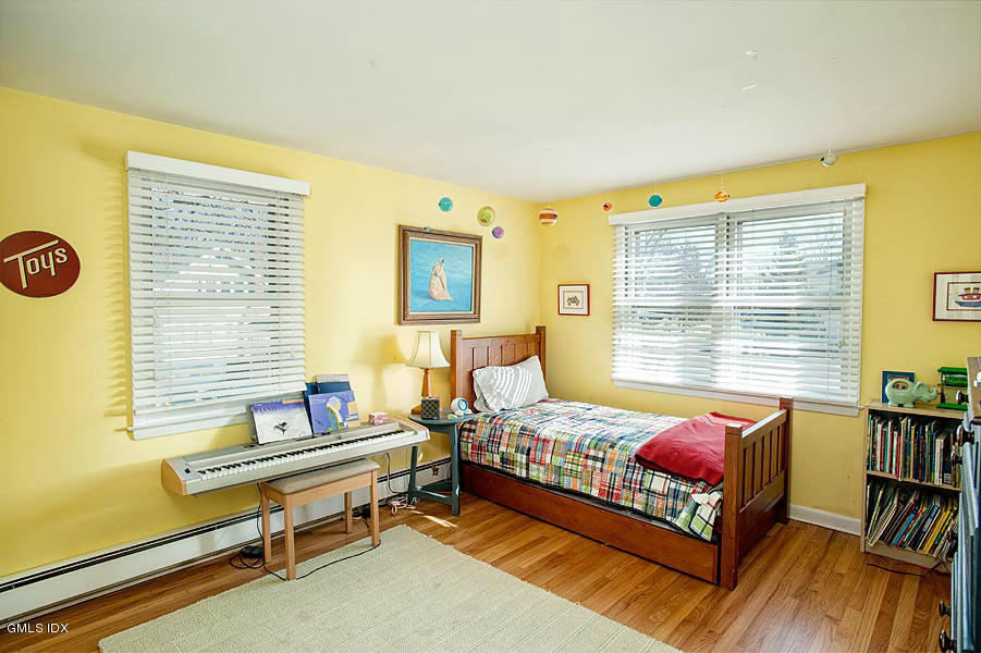 42 Field Road Cos Cob, CT 06807 - Photo 10 of 14 a bedroom with a bed and a window