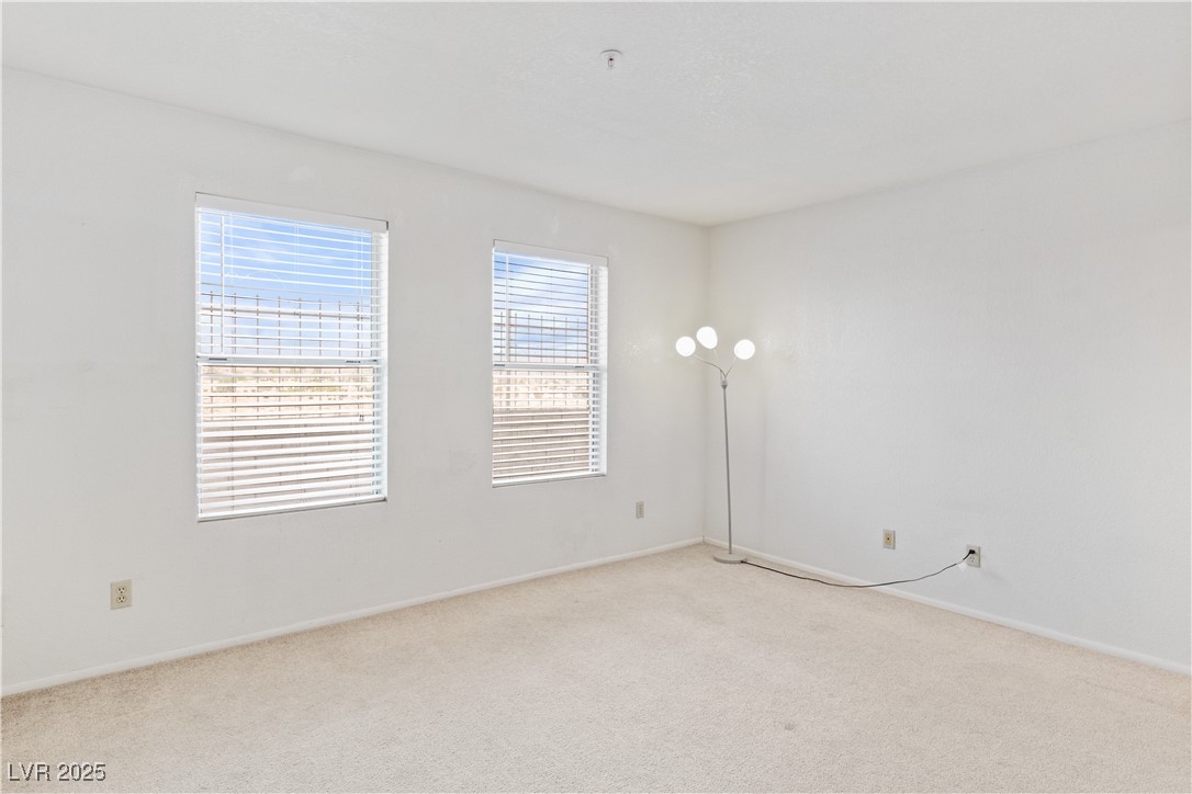 2036 Mesquite Lane, Unit 103 Laughlin, NV 89029 - Photo 20 of 67 Spare room featuring light colored carpet