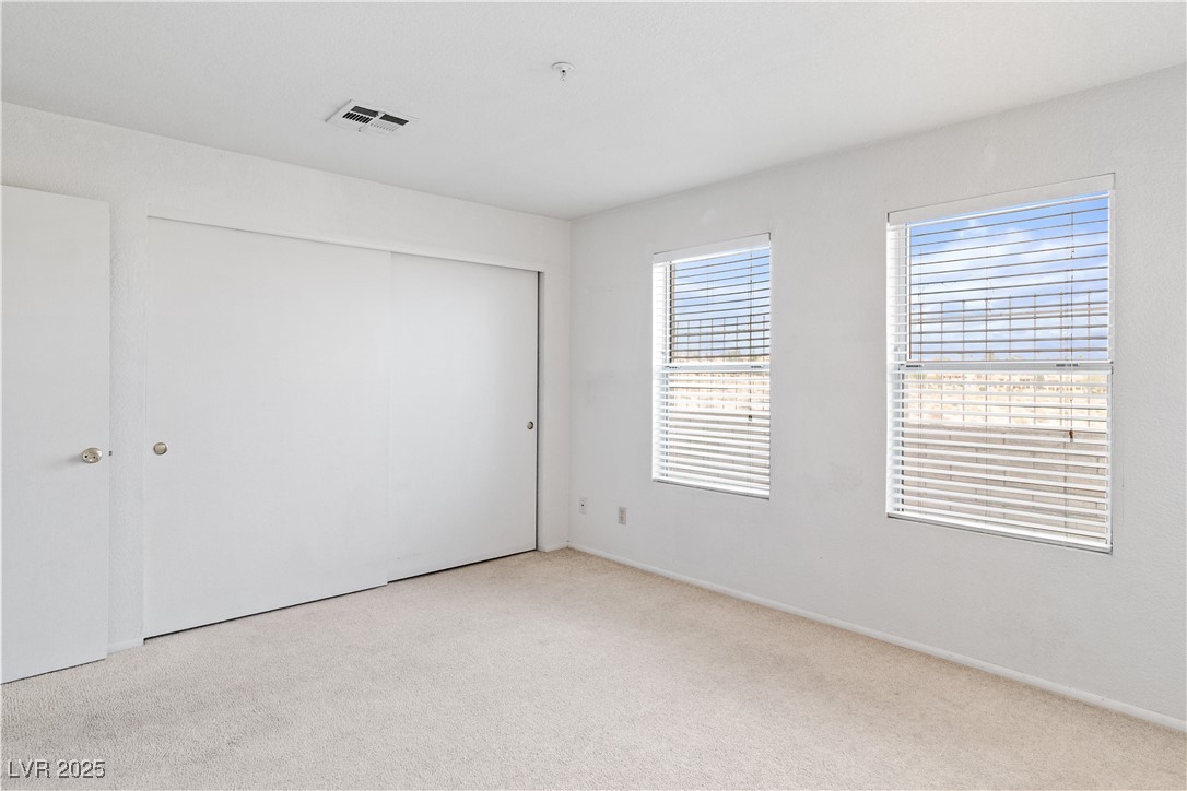 2036 Mesquite Lane, Unit 103 Laughlin, NV 89029 - Photo 21 of 67 Carpeted spare room featuring visible vents