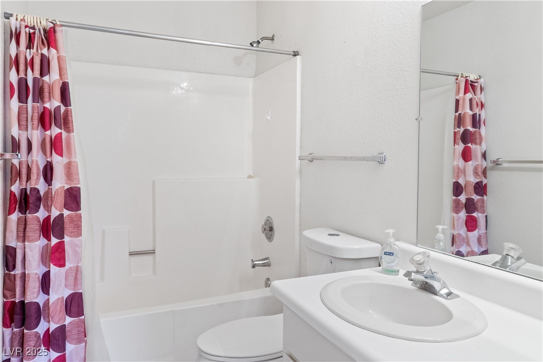 2036 Mesquite Lane, Unit 103 Laughlin, NV 89029 - Photo 24 of 67 Full bath with shower / bathtub combination with curtain, toilet, and vanity