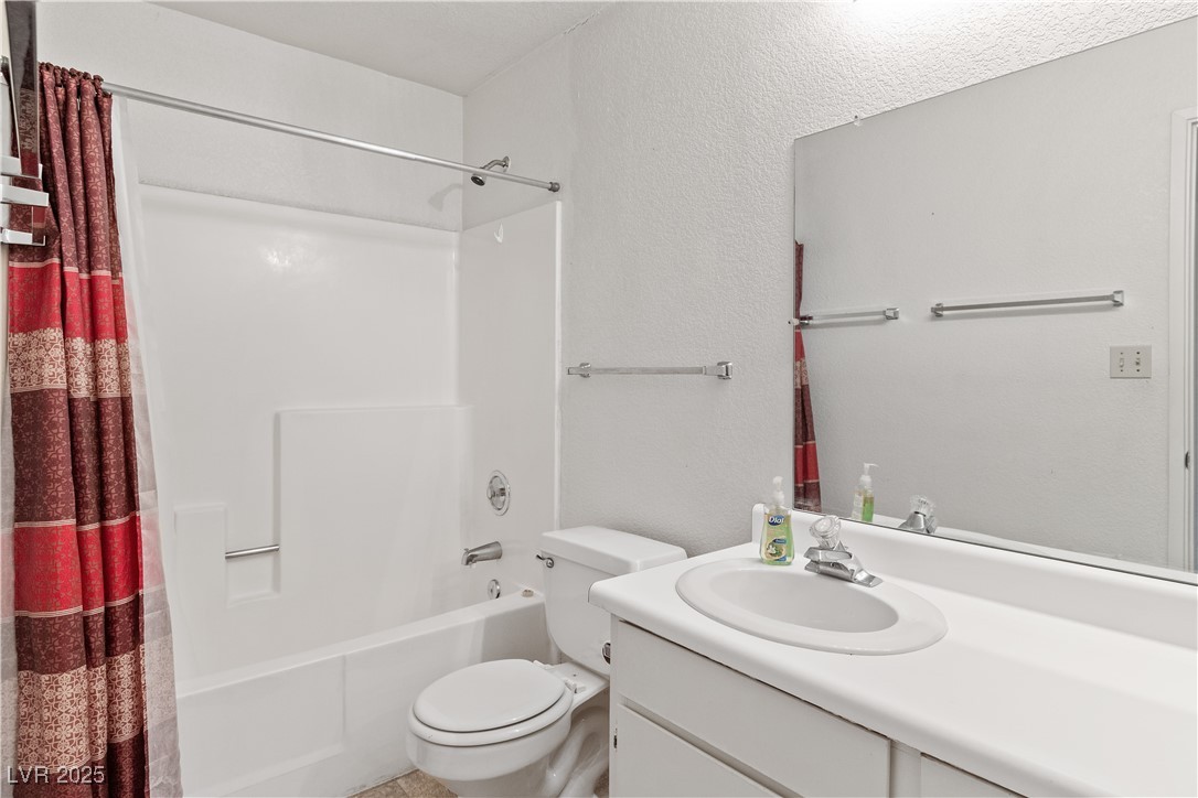 2036 Mesquite Lane, Unit 103 Laughlin, NV 89029 - Photo 28 of 67 Bathroom featuring shower / bath combo, toilet, and vanity