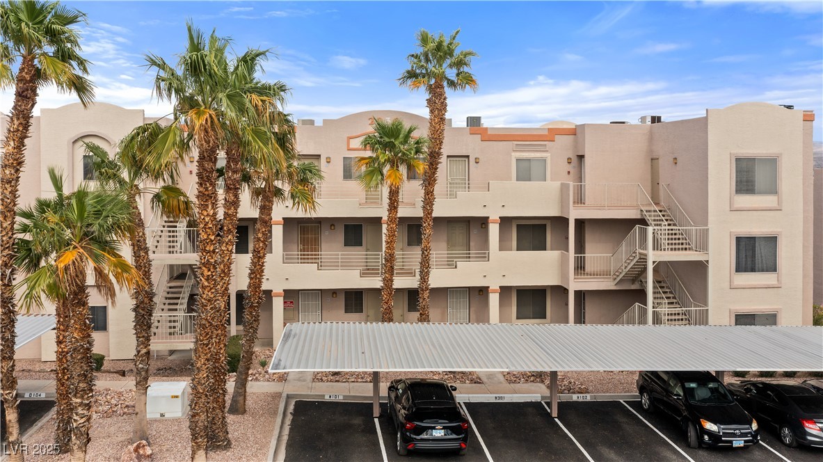 2036 Mesquite Lane, Unit 103 Laughlin, NV 89029 - Photo 36 of 67 View of building exterior with covered and uncovered parking and stairway