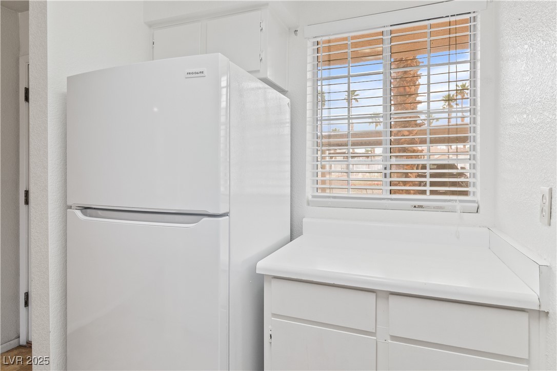 2036 Mesquite Lane, Unit 103 Laughlin, NV 89029 - Photo 10 of 67 Washroom featuring a wealth of natural light and a textured wall