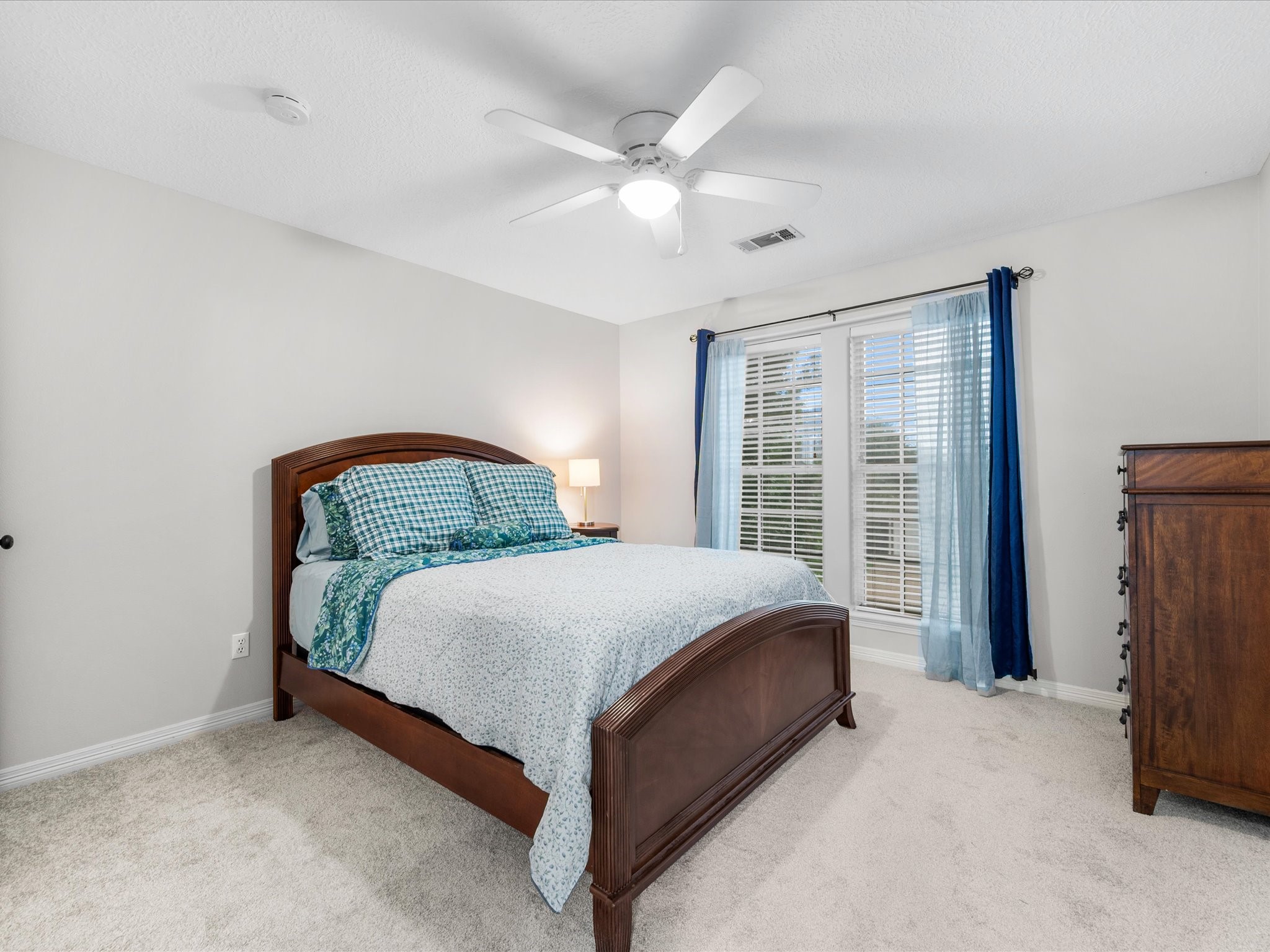 5910 Center Ct Drive Spring, TX 77379 - Photo 29 of 50 The secondary bedrooms are spacious and well-proportioned, each offering a comfortable retreat with thoughtful natural light and an inviting atmosphere.