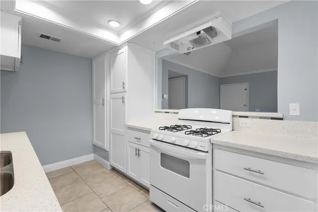 a kitchen with a stove and a sink
