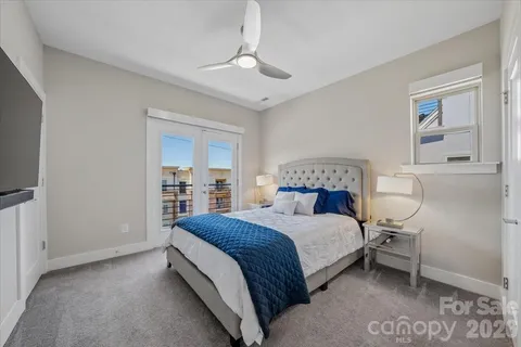 a bedroom with a bed and a lamp