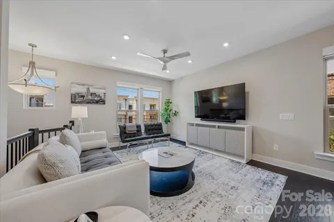a living room with furniture and a rug